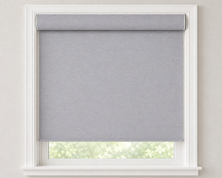 Fabric covered round cassette headrail on a roller shade