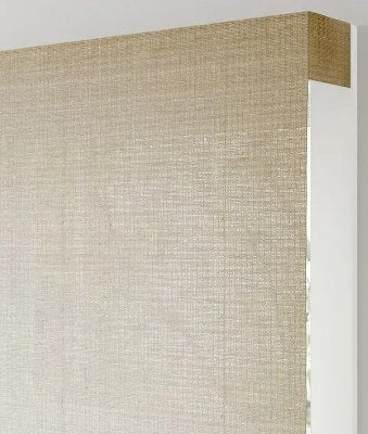 Waterfall woven shade with the fabric cascading over the headrail
